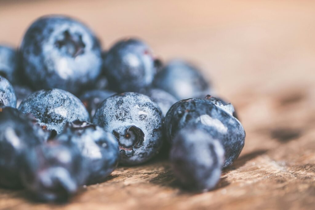 Macro shot of fresh blueberries on wood. Perfect for healthy food concepts.