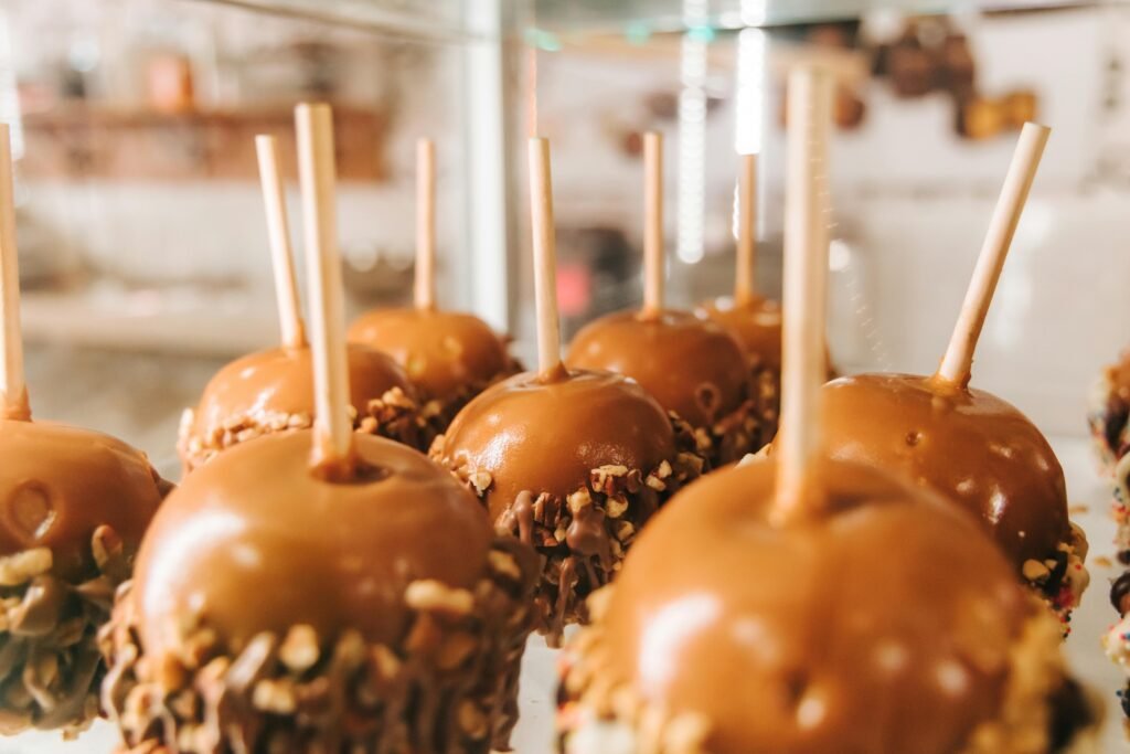 Close-up of caramel apples with nuts on display in San Antonio.